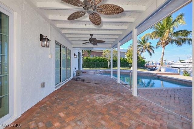 view of pool featuring a water view, ceiling fan, and a patio