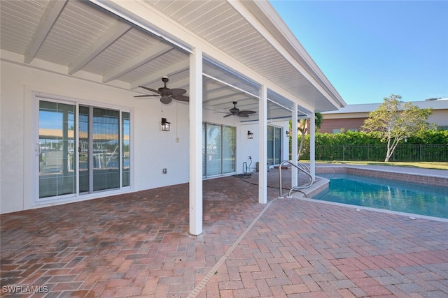 view of pool with a patio and ceiling fan