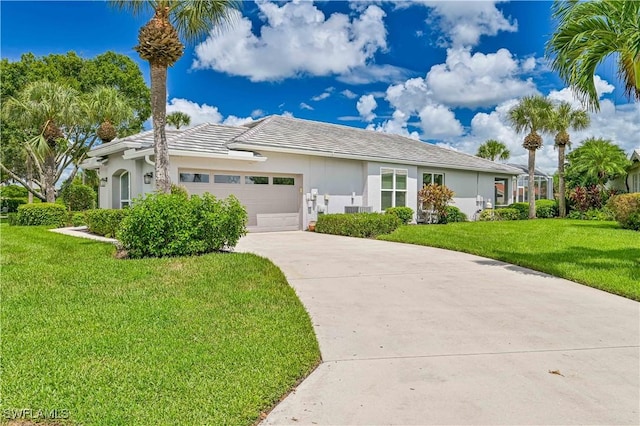 view of front of house with a garage and a front yard