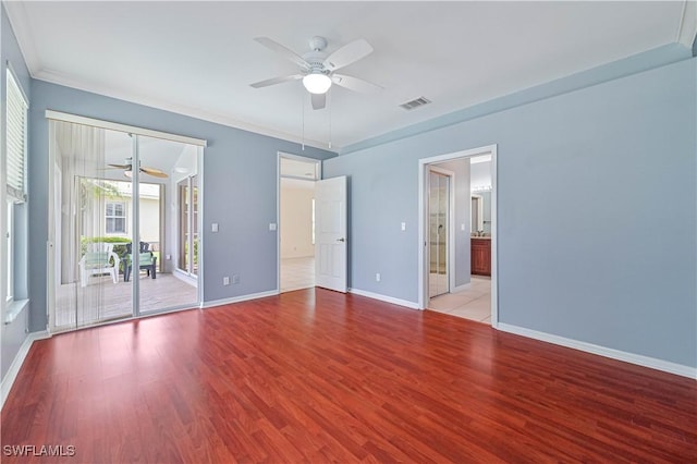 spare room with ornamental molding, ceiling fan, and light hardwood / wood-style flooring