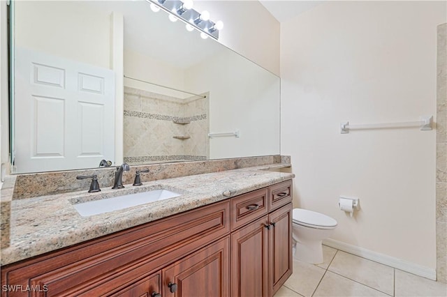 bathroom with tiled shower, tile patterned floors, toilet, and vanity