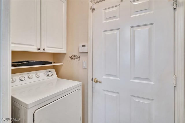 laundry area with washer / clothes dryer and cabinets