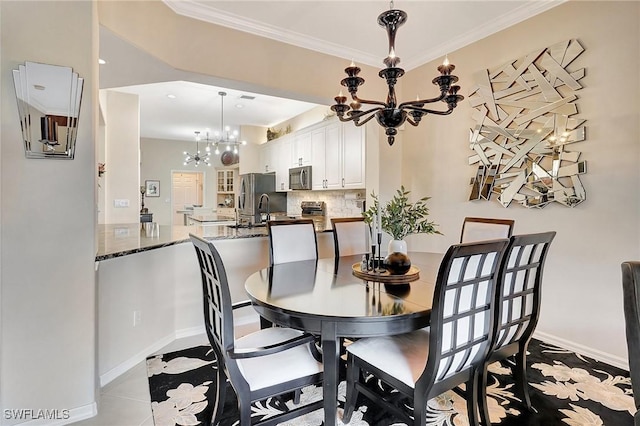 dining space with an inviting chandelier, light tile patterned floors, and crown molding