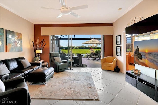 living room with ornamental molding, light tile patterned floors, and ceiling fan