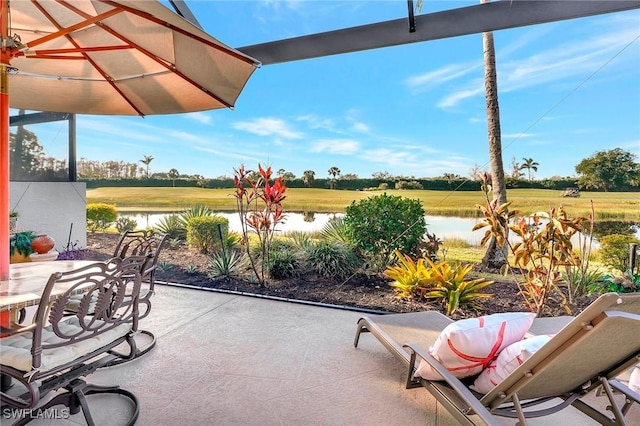 view of patio / terrace with a water view