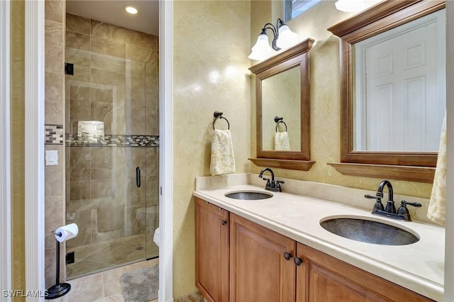 bathroom with vanity, toilet, and a shower with door