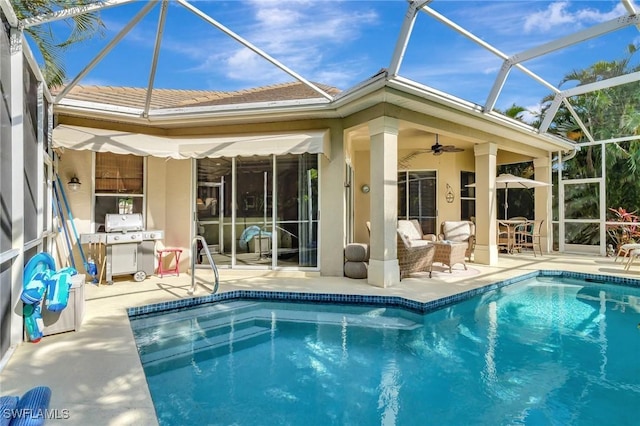 exterior space featuring ceiling fan, glass enclosure, and a patio area