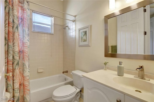 full bathroom with vanity, toilet, and shower / bath combo with shower curtain