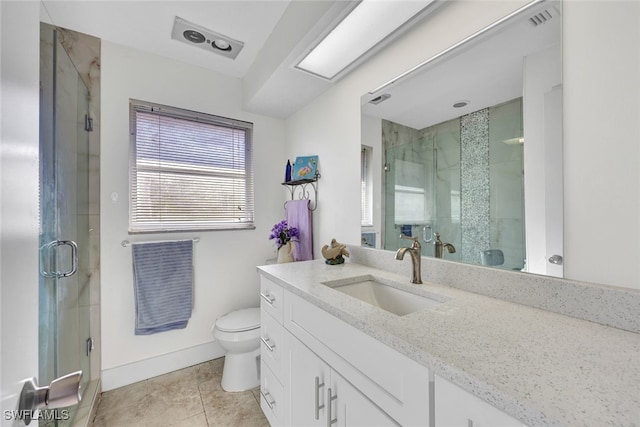 bathroom featuring walk in shower, tile patterned floors, vanity, and toilet