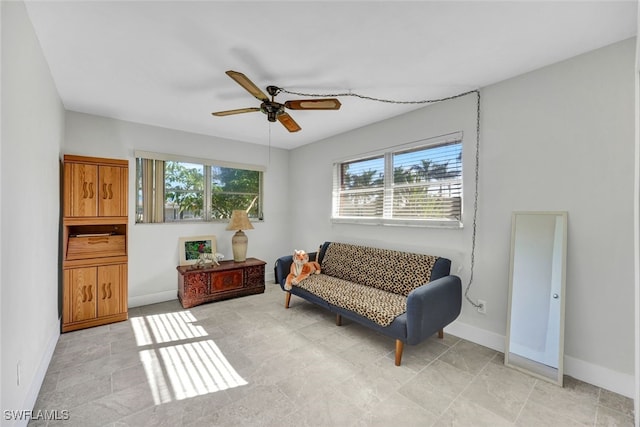 sitting room with ceiling fan