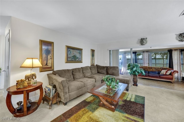 living room with light tile patterned floors