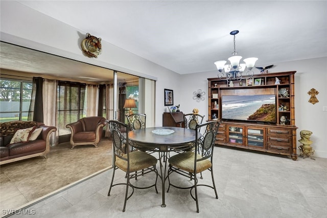 dining area with an inviting chandelier