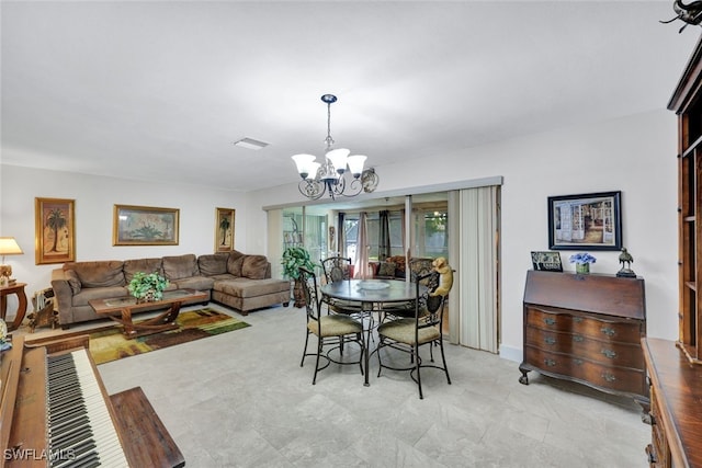 dining room featuring a notable chandelier