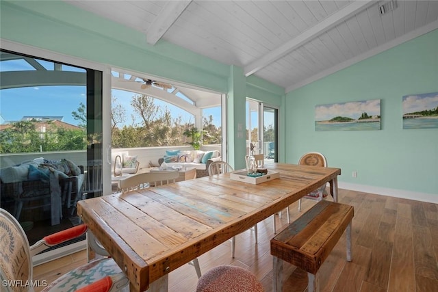 sunroom featuring wooden ceiling, vaulted ceiling with beams, and ceiling fan