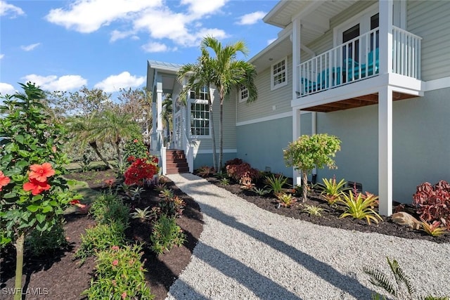 view of home's exterior with a balcony