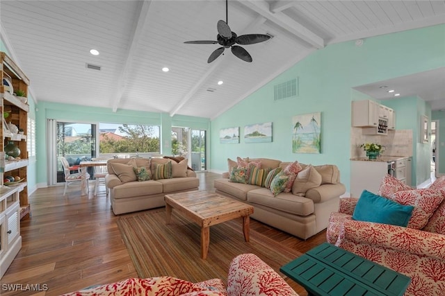 living room featuring dark hardwood / wood-style flooring and lofted ceiling with beams