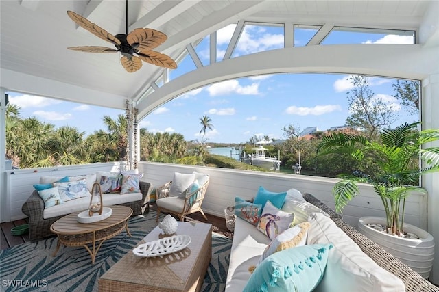 view of patio with a water view, an outdoor hangout area, and ceiling fan