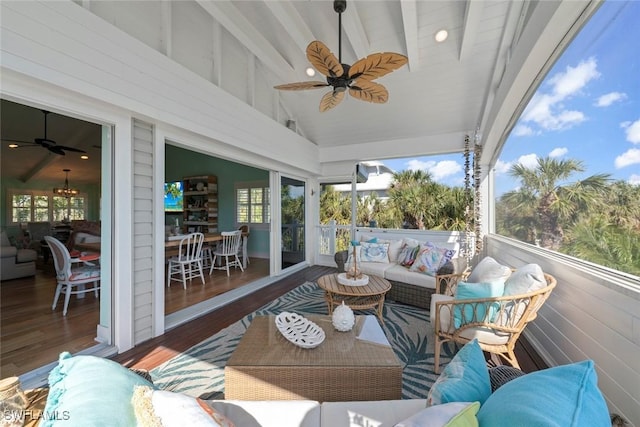 sunroom featuring ceiling fan and an outdoor hangout area