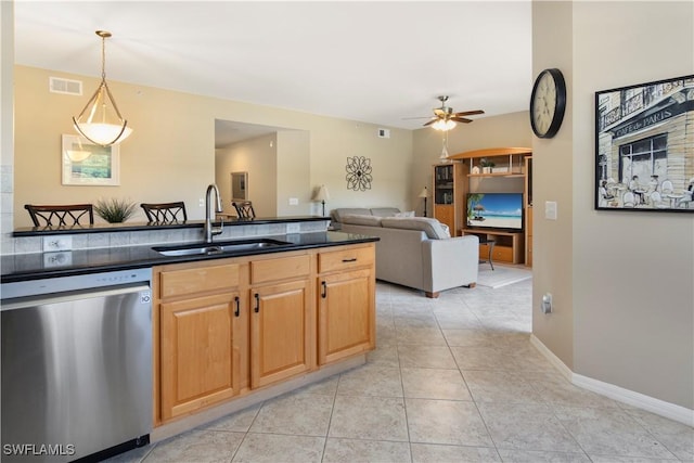 kitchen featuring sink, light tile patterned floors, ceiling fan, decorative light fixtures, and stainless steel dishwasher