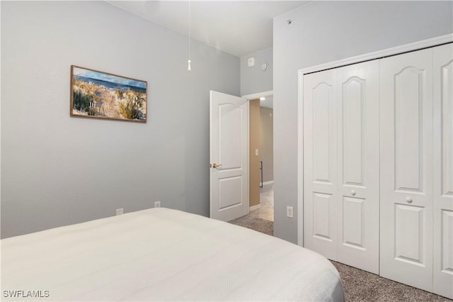 carpeted bedroom featuring a closet