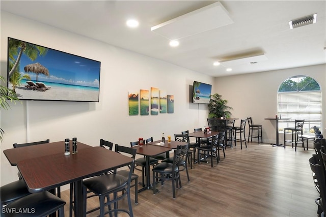 dining space featuring wood-type flooring