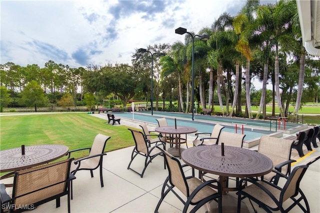 view of patio with a community pool