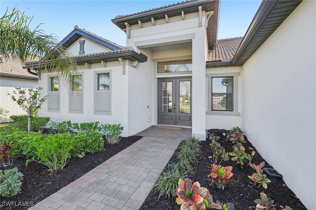 view of exterior entry featuring french doors