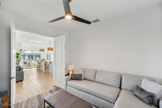 living room featuring ceiling fan