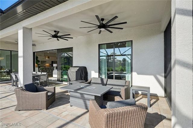 view of patio / terrace with an outdoor living space and ceiling fan