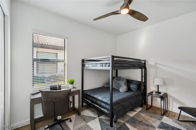 bedroom featuring wood-type flooring and ceiling fan