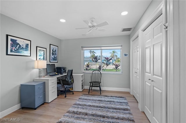 office area with ceiling fan and light hardwood / wood-style flooring