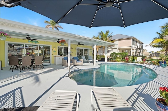 view of pool featuring a patio area, outdoor lounge area, and ceiling fan