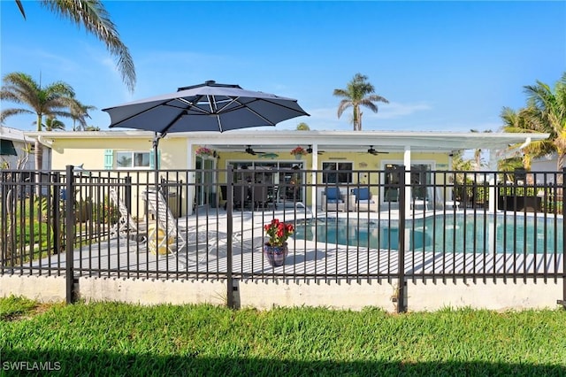 view of pool with ceiling fan and a patio area