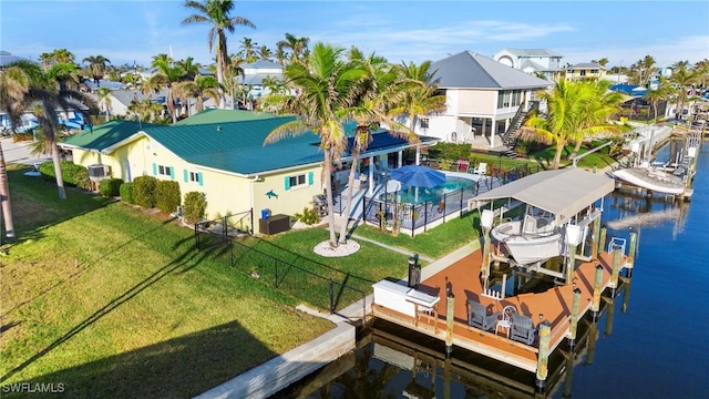 birds eye view of property with a water view