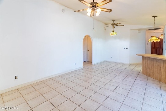 unfurnished room featuring lofted ceiling and ceiling fan