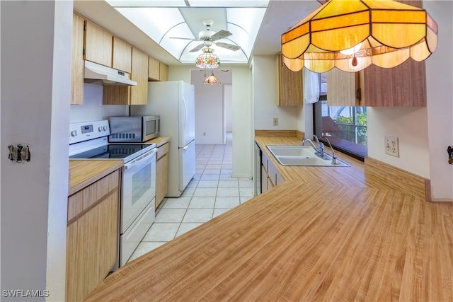 kitchen with sink, light brown cabinets, light tile patterned floors, ceiling fan, and stainless steel appliances