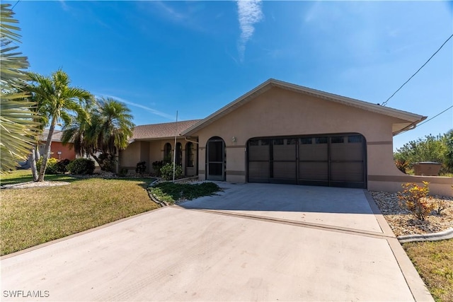 ranch-style home with a garage and a front yard