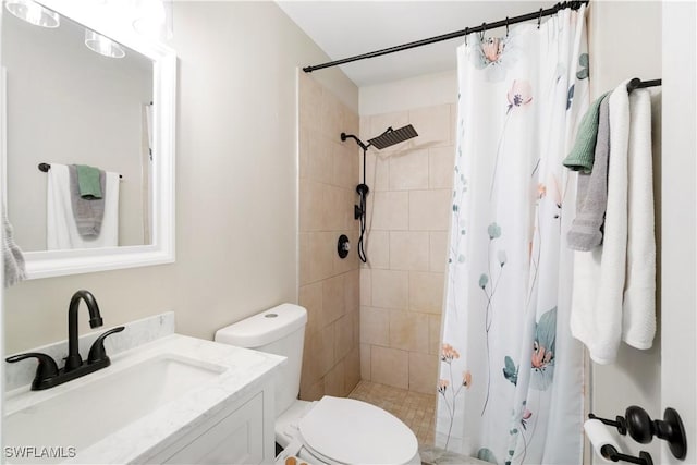 bathroom featuring vanity, toilet, and a shower with shower curtain