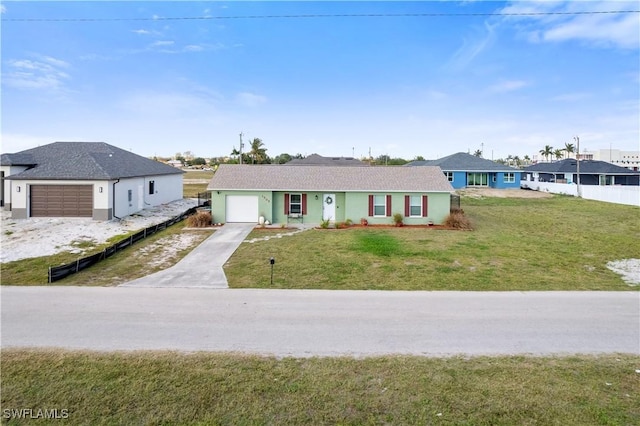 ranch-style home with a garage and a front yard