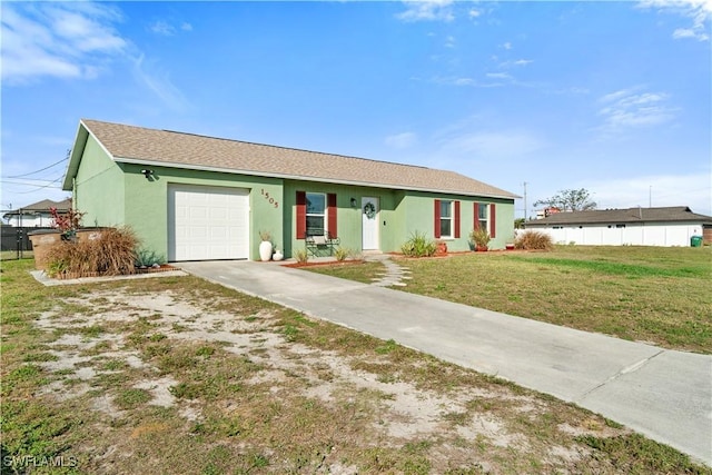 ranch-style home with a front yard, fence, driveway, stucco siding, and a garage