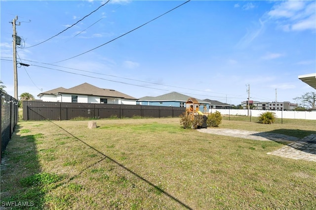 view of yard with a fenced backyard