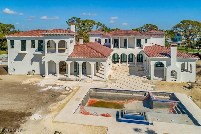 back of house featuring a patio area