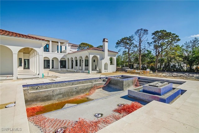 back of house featuring a patio