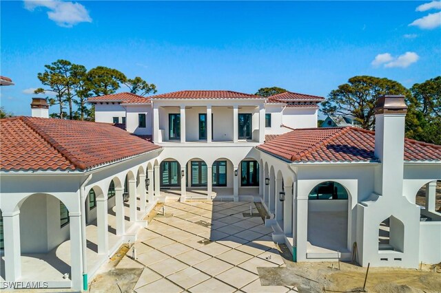 rear view of property with a patio area