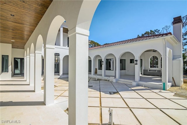 rear view of property featuring a patio