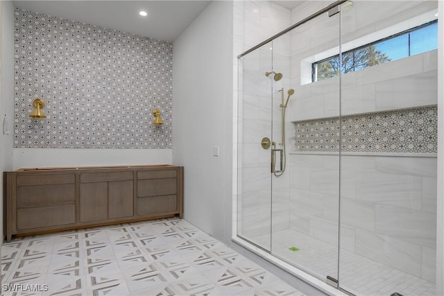 bathroom with a shower with door