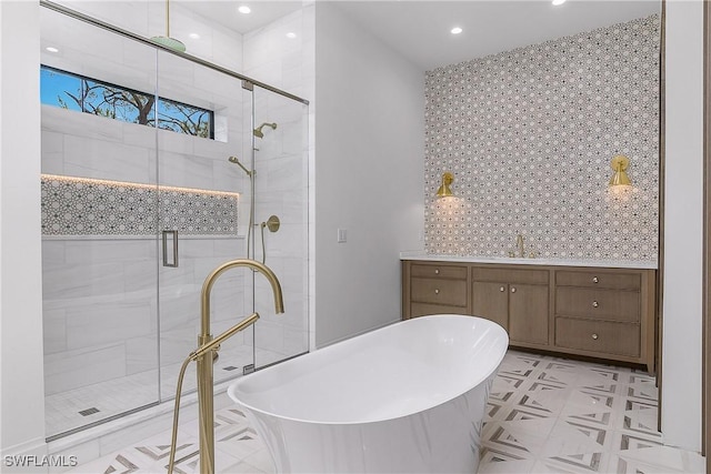 50 Mahogany Dr, Naples, FL 34108 - bathroom featuring a freestanding tub, recessed lighting, a shower stall, and vanity
