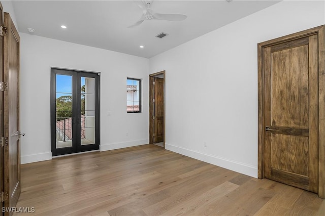 50 Mahogany Dr, Naples, FL 34108 - interior space featuring baseboards, light wood-type flooring, access to outside, and french doors
