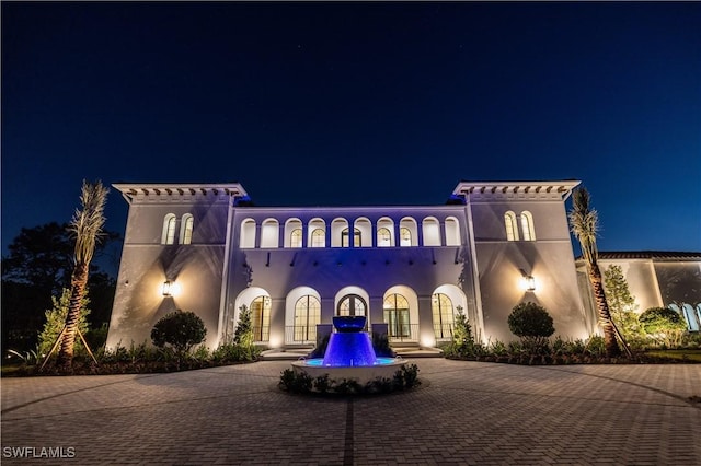 50 Mahogany Dr, Naples, FL 34108 - view of front of house featuring curved driveway and stucco siding