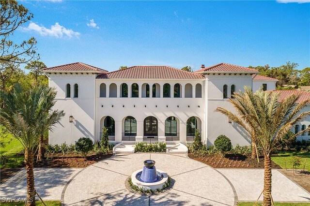 50 Mahogany Dr, Naples, FL 34108 - view of front of home with stucco siding and a tile roof
